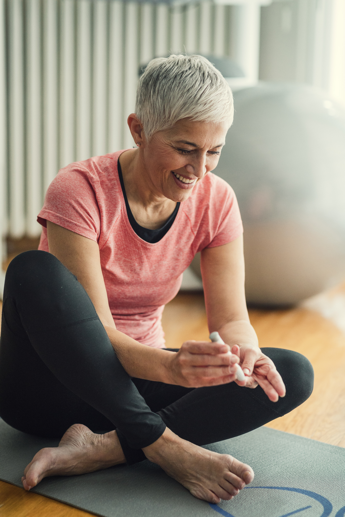 Mature Woman Doing Blood Sugar Test after exercise.